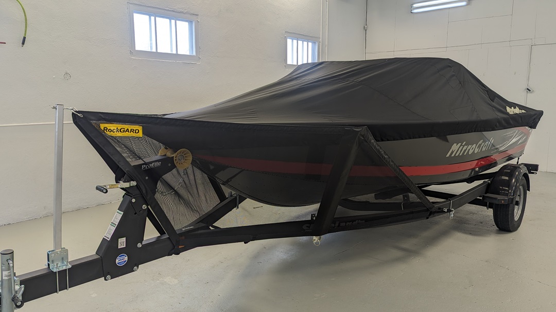 RockGARD V-front protection system installed on a covered boat and trailer
